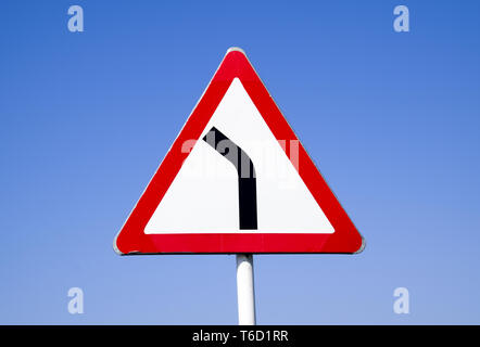 Dangerous turns, warning traffic sign isolated on white background Stock  Photo - Alamy