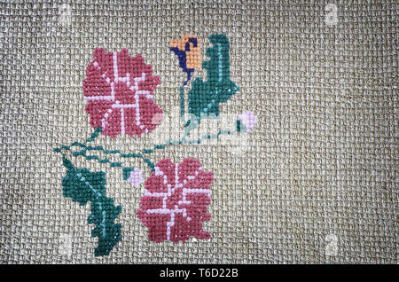 Craft: embroidered cross-stitch flowers beautiful. Stock Photo