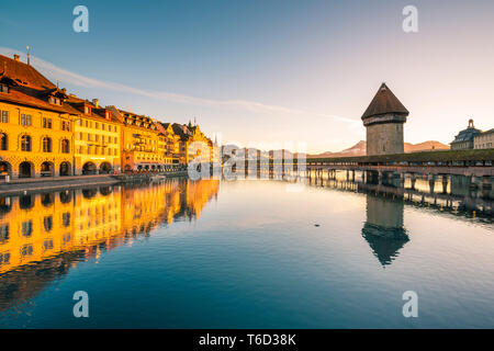 Lucerne, Switzerland. KapellbrÃ¼cke (Chapel Bridge) and water tower on Reuss river at sunrise Stock Photo