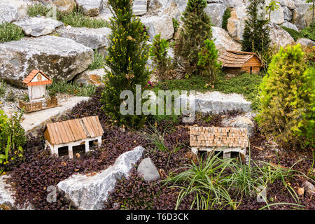 Outdoor models of various rural buildings, garden decoration Stock Photo