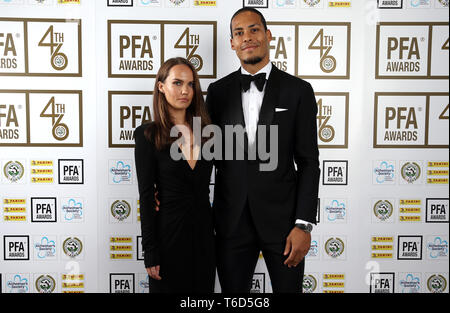 Rike Nooitgedagt (left) and Liverpool's Virgil van Dijk pose for photographs during the 2019 PFA Awards at the Grosvenor House Hotel, London. Stock Photo