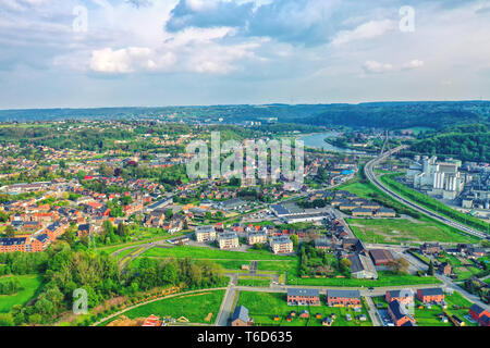 View over the city of Huy in Belgium and Meuse River to the distant nuclear power station of Tihange Stock Photo
