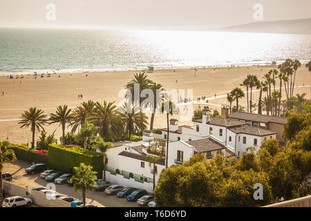 Ocean view on beach of Santa Monica in sunset, monochrome golden light Stock Photo