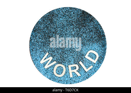 Mixed black and blue decorative sand with applied wooden letters with the word WORLD in the lower half isolated on white. Stock Photo