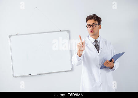 Funny doctor scientist making presentation in hospital Stock Photo