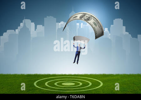 Businessman in golden parachute concept Stock Photo