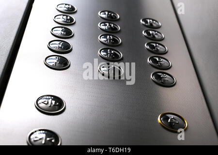 Tactile digit icons for the visually impaired. Elevator buttons. Selective focus close-up Stock Photo