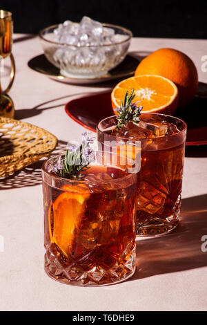 Negroni, an Iba cocktail, with 1/3 gin, 1/3 bitter, 1/3 vermut, in luxury pop style, rich and colorful. Stock Photo