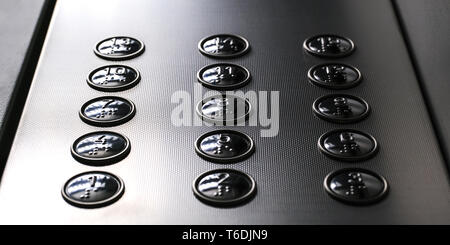 Tactile digit icons for the visually impaired. Elevator buttons. Selective focus close-up Stock Photo