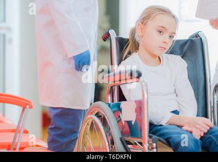 Caucasian Ten Year Old Girl on a Wheelchair During Rehabilitation. Stock Photo