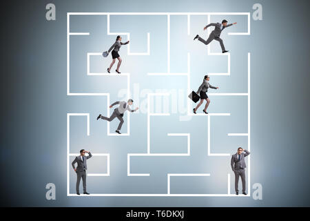 Business people getting lost in maze uncertainty concept Stock Photo