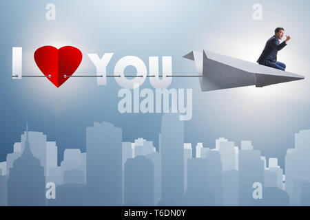 Romantic concept with man on paper plane I Love you Stock Photo