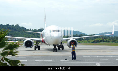 KEDAH, LANGKAWI, MALAYSIA - APR 11th, 2015: Malaysia Airline plane Boeing 737-800 at Langkawi international airport Stock Photo