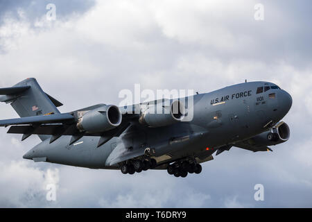 Frame filling shot of a C-17A from the 911th Airlift Wing coming into land at  RAF Mildenhall in Suffolk during April 2019. Stock Photo