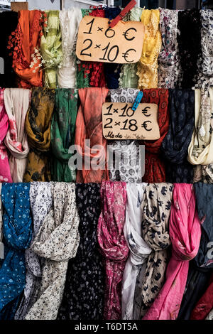 Close up of a large selection of colourful scarves at a market stall. Venice Italy Stock Photo