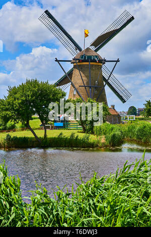 Netherlands rural lanscape with windmills at famous tourist site Kinderdijk in Holland. Old Dutch village Kinderdijk, UNESCO world heritage site. Stock Photo