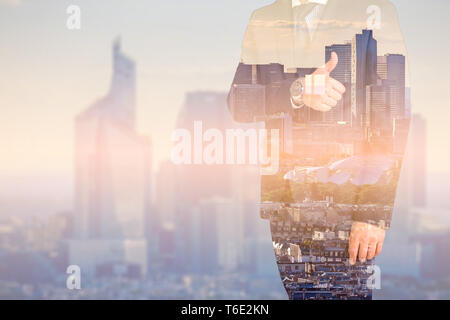 Business man shows thumb up with multiple exposure. Global business concept Stock Photo