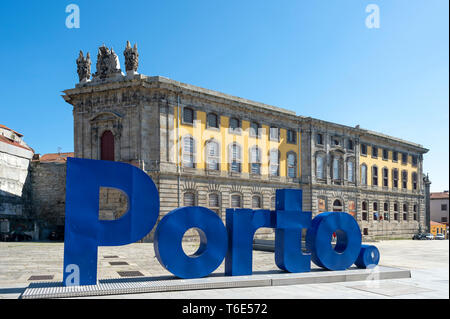 Centro Portugues de Fotografia in Porto, with large blue Porto sign in the foreground. Originally a prison. Stock Photo