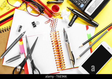 Workplace composition with smartphone, notebooks and stationery on table, flat lay Stock Photo