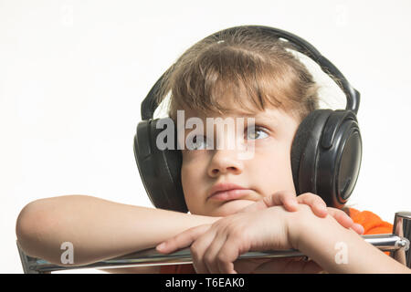 Portrait of a girl in headphones listening to music musically Stock Photo