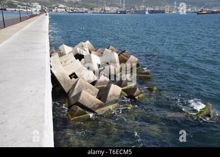 Breakwater of the rectangular stone figures. Stock Photo