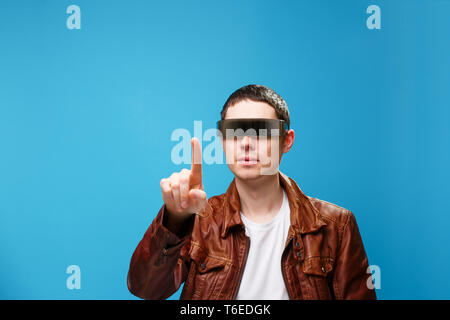 A man is using the glasses of virtual reality. Stock Photo