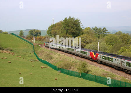 Two class 221 super voyager diesel multiple units in Virgin West Coast livery on the West Coast Mainline near Grayrigg in Cumbria on 30th April 2019. Stock Photo