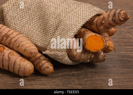stack of turmeric on grunge wooden background Stock Photo