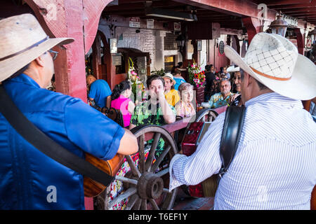 A traditional mexican street band playing at popular Olvera Street in Los Angeles, California, USA Stock Photo