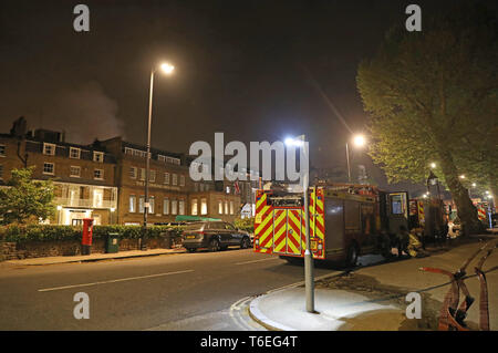 Firefighters at the scene of a large blaze at a spa joined to a hotel in west London. Around 100 firefighters are in attendance as they try to put out the fire at the building, in Richmond Hill. Stock Photo