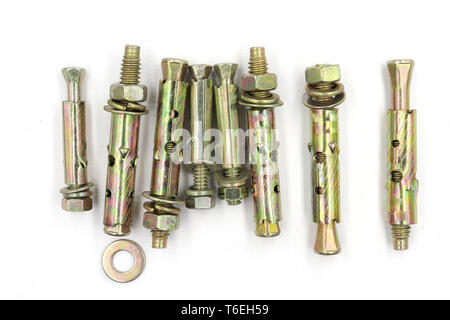 Close up steel nuts  expansion anchors bolts and wrench isolate on white background. High resolution image gallery. Stock Photo