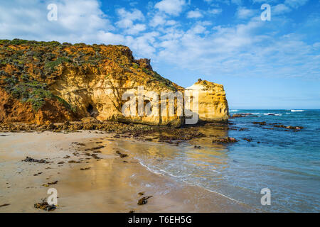 A beautiful view of a sea with huge rocks and an island under the ...