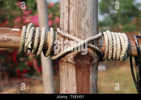 old rope on bamboo pole, Vintage streetlights bamboo pole. High resolution image gallery. Stock Photo