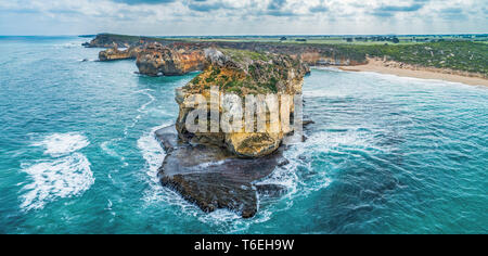 Closeup view of ocean waves crushing over beautiful rocks in Victoria, Australia Stock Photo