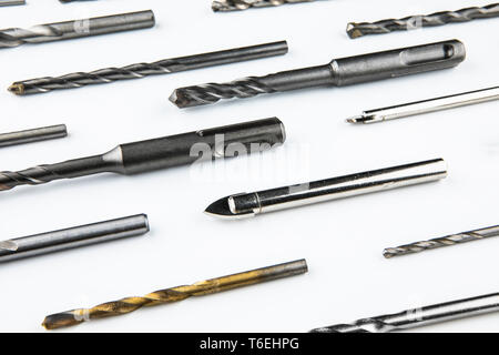 Drill bits of different sizes over white background Stock Photo
