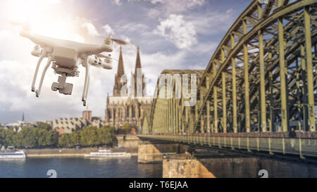 drone flying in front of Cologne Cathedral and Bridge Stock Photo