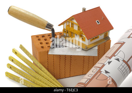 brick for house construction and tools isolated over white background Stock Photo