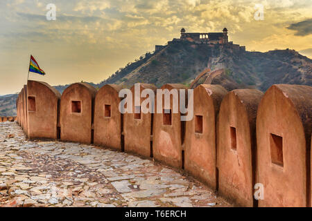 Ancient long wall with towers around Amber Fort, and view of Jaigarh Fort. Jaipur. Rajasthan. India Stock Photo