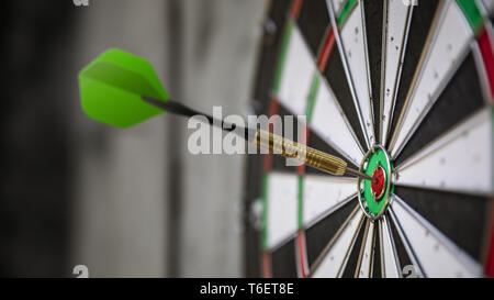 a typical darts game with dart in the bullseye Stock Photo