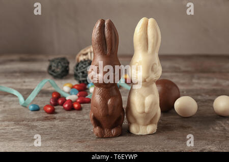 Chocolate Easter bunnies on wooden table Stock Photo