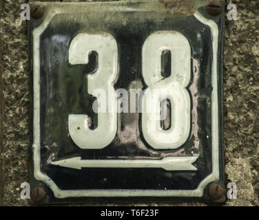Weathered enameled plate number 38 Stock Photo