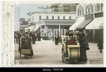 Detroit Publishing Company vintage postcard reproduction of the crowded Boardwalk in Atlantic City, New Jersey, 1905. From the New York Public Library. () Stock Photo