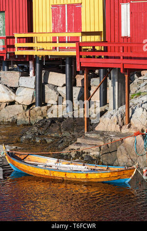 Old rowing boat in the water at the fishing sheds Stock Photo