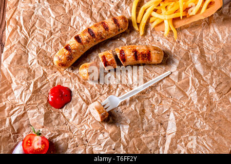 rustic bratwurst with pommes and hot ketchup Stock Photo