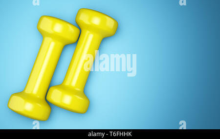 yellow dumbbells isolated on blue background Stock Photo