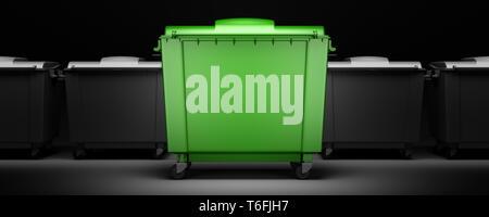 green garbage container among gray containers isolated on dark background Stock Photo