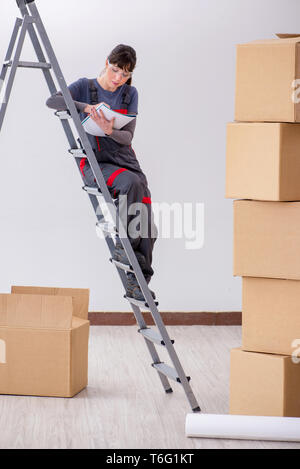 Woman builder thinking of renovating new apartment Stock Photo