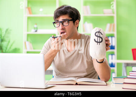 Young student in expensive tuition concept Stock Photo
