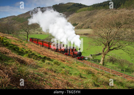 A scene reminiscent of the 1880's with a mixed train approaching Abergynolwyn Stock Photo