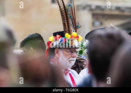 Oxford, UK. 1st May, 2019. Crowds of people gathered on Magdalene bridge to hear a choir singing atop the Magdalene College Tower for a yearlong tradition during Mayday celebration. Dancing in the street follows after a night of drinking and university mayday dance. Credit: Pete Lusabia/Alamy Live News Stock Photo